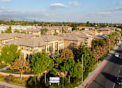 Thumbnail 75 of 80 - A large, well-maintained residential complex with a clear sky above.