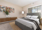 Thumbnail 8 of 80 - a bedroom with a bed and a window