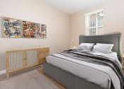Thumbnail 5 of 80 - a bedroom with a bed and two windows