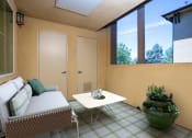 Thumbnail 3 of 80 - a small patio with a couch and a coffee table