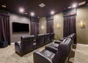 Thumbnail 14 of 80 - a large screening room with leather seats and a large screen tv