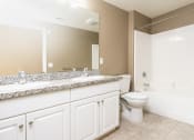 Thumbnail 41 of 80 - a bathroom with a toilet sink and bathtub