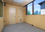 Thumbnail 36 of 80 - an empty room with a large window and two doors