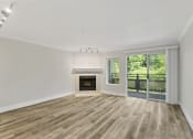 Thumbnail 39 of 73 - a living room with a fireplace and a balcony at Lakemont Orchard, Issaquah Washington  