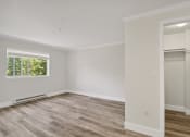 Thumbnail 40 of 73 - a bedroom with hardwood floors and grey walls at Lakemont Orchard, Issaquah  