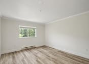 Thumbnail 45 of 73 - an empty bedroom with wood style flooring and a window at Lakemont Orchard, Issaquah, 98027  