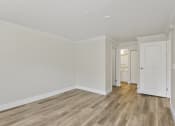 Thumbnail 46 of 73 - a bedroom with wood style floors and white walls at Lakemont Orchard, Issaquah Washington  