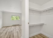 Thumbnail 48 of 73 - a bedroom with hardwood floors and white walls at Lakemont Orchard, Washington  