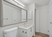 Thumbnail 53 of 73 - a bathroom with a toilet sink and mirror at Lakemont Orchard, Issaquah Washington  