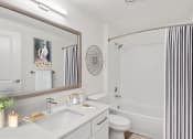Thumbnail 33 of 73 - a bathroom with white walls and a white toilet next to a white tub at Lakemont Orchard, Washington  