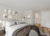 Thumbnail 29 of 73 - a bedroom with a bed and a door to a bathroom at Lakemont Orchard, Issaquah, WA 98027  