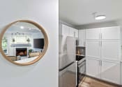 Thumbnail 65 of 73 - a mirror and a white kitchen with a fireplace at Lakemont Orchard, Issaquah, 98027  