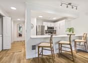 Thumbnail 69 of 73 - a kitchen with a bar and stools in a house at Lakemont Orchard, Washington, 98027