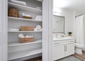 Thumbnail 70 of 73 - a white bathroom with open shelving and a white toilet and sink at Lakemont Orchard, Issaquah Washington  