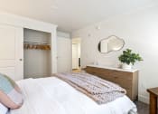 Thumbnail 72 of 73 - a bedroom with a white bed and a mirror on the wall at Lakemont Orchard, Issaquah, WA 98027  