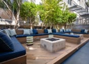 Thumbnail 81 of 84 - eating area with couches and a fire pit in a courtyard at Level at Sixteenth, Phoenix, 85014