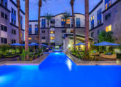 Thumbnail 11 of 84 - resort-style pool lit at night with palm tree at Level at Sixteenth, Arizona