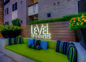 Thumbnail 13 of 84 - outdoor seating with property monument sign at Level at Sixteenth, Phoenix, AZ, Arizona, 85014