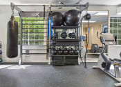 Thumbnail 11 of 73 - a gym with a punching bag and fitness equipment at Lakemont Orchard, Washington  