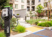 Thumbnail 11 of 72 - an electric charger in front of an apartment building