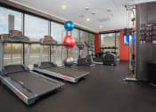 Thumbnail 13 of 72 - a gym with treadmills and other exercise equipment