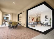 Thumbnail 14 of 72 - a large window in a room with a table and chairs