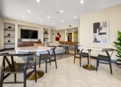 Thumbnail 15 of 72 - a resident clubhouse with tables and chairs