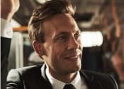 Thumbnail 23 of 24 - a man in a suit on a bus at NoMa Apartments, California, 94596