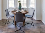 Thumbnail 15 of 39 - Dining Area With Circle Table, Spacious Windows, And Table Decorations at McDermott Place, Plano, 75025
