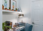 Thumbnail 19 of 39 - Study Area With Desk, Blue Chair, And Study Lamp at McDermott Place, Plano, TX 75025