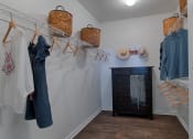 Thumbnail 18 of 39 - a walk in closet with a dresser and hangers at McDermott Place, Texas 75025