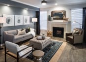 Thumbnail 34 of 39 - a living room with a fireplace and couches at McDermott Place, Texas