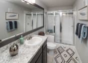 Thumbnail 28 of 39 - a bathroom with a sink and a shower and a toilet at McDermott Place, Texas 75025