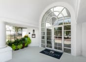Thumbnail 4 of 39 - a large white building with a large glass door at McDermott Place, Plano, 75025