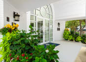 Thumbnail 23 of 39 - a large white building with a large glass door at McDermott Place, Texas 75025