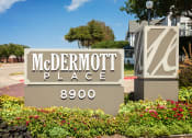 Thumbnail 22 of 39 - Front Welcome Sign Of McDermott Place With Lush Green Landscaping And Street View at McDermott Place, Plano, 75025