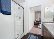 Thumbnail 69 of 78 - a bathroom with a shower and a bedroom with a bed at Miro at the Parc, Henderson, NV 89074