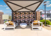 Thumbnail 18 of 78 - a patio with two chairs and a table under a gazebo at Miro at the Parc, Henderson