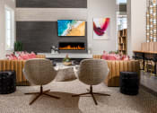 Thumbnail 3 of 78 - a living room with a fireplace and a table and chairs at Miro at the Parc, Nevada 89074