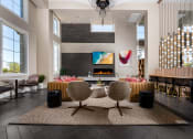 Thumbnail 7 of 78 - a living room with a fireplace and a table and chairs at Miro at the Parc, Henderson, NV