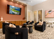 Thumbnail 5 of 78 - a living room with couches and chairs and a tv on the wall at Miro at the Parc, Nevada 89074