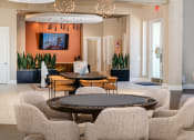 Thumbnail 4 of 78 - a living room with tables and chairs and a television at Miro at the Parc, Henderson, 89074