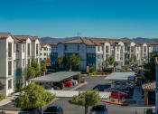 Thumbnail 31 of 78 - an aerial view of a parking lot with the building exterior at Miro at the Parc, Nevada 89074