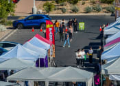 Thumbnail 41 of 78 - people walking around the farmers market at Miro at the Parc, Nevada