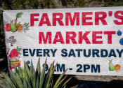 Thumbnail 38 of 78 - a farmers market sign is displayed in front of a plant at Miro at the Parc, Henderson, NV 89074