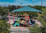 Thumbnail 50 of 78 - a playground at a park with a green roof at Miro at the Parc, Henderson, Nevada