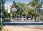 Thumbnail 55 of 78 - a group of men playing basketball on a basketball court at Miro at the Parc, Nevada 89074