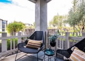 Thumbnail 25 of 36 - Patio with seating at Montrachet Apartments, Napa