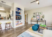 Thumbnail 26 of 36 - Living and kitchen area with bar seating at Montrachet Apartments, California
