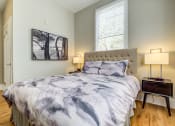 Thumbnail 29 of 36 - Bedroom with window at Montrachet Apartments, Napa, California